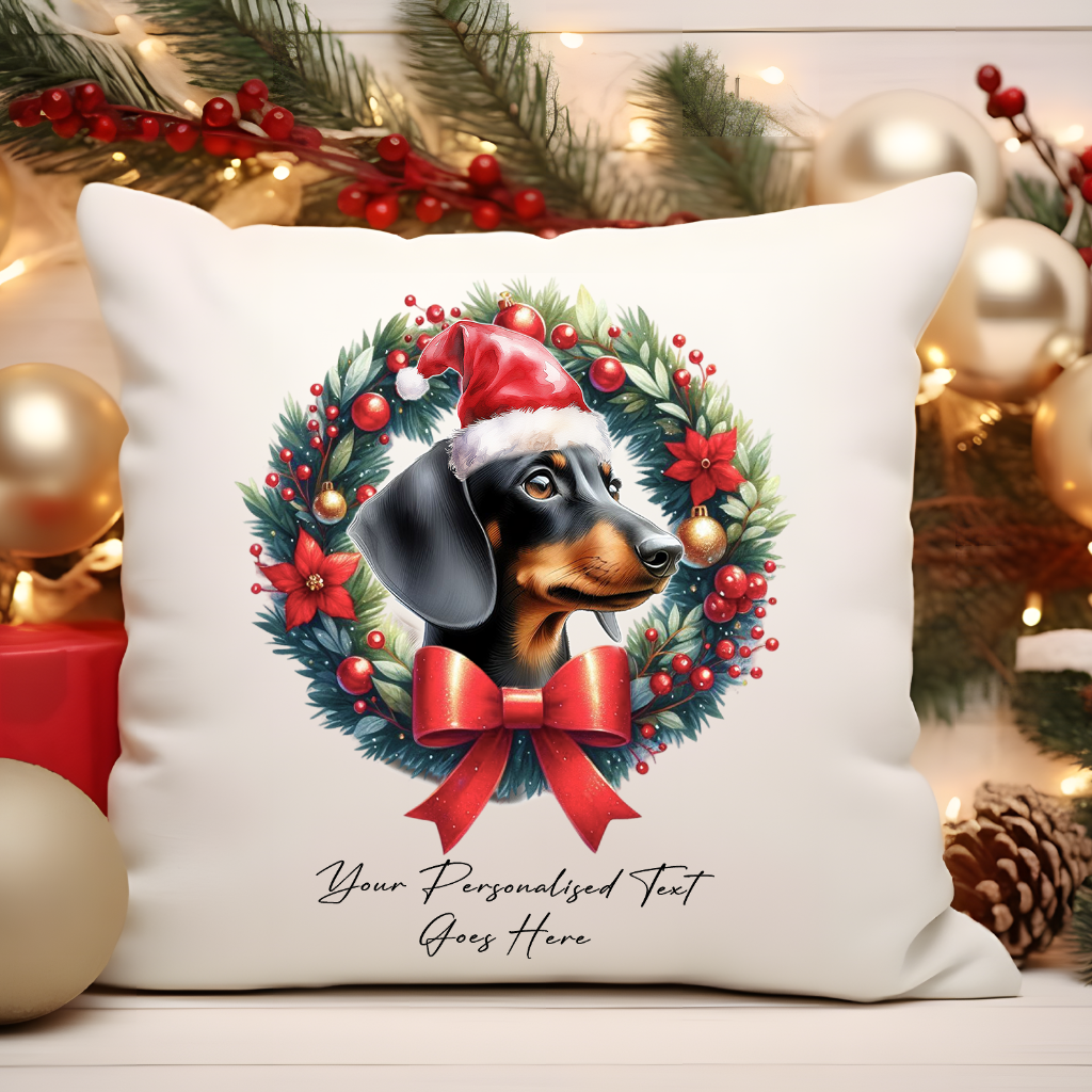 Personalised Black and Tan Dachshund with Santa Hat in a Christmas wreath - Keepsake Gift cushion, by Floppsie Moppsie – floppsiemoppsie at floppsiemoppsie.co.uk