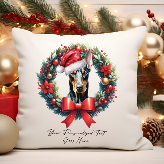 Personalised Doberman with Santa Hat in a Christmas wreath - Keepsake Gift cushion, by Floppsie Moppsie – floppsiemoppsie at floppsiemoppsie.co.uk