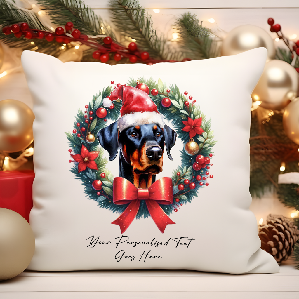 Personalised Doberman with Santa Hat in a Christmas wreath - Keepsake Gift cushion, by Floppsie Moppsie – floppsiemoppsie at floppsiemoppsie.co.uk