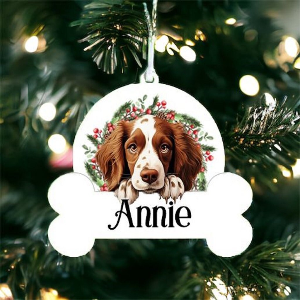 Personalised Christmas Bauble with Welsh Springer Spaniel sat in a wreath