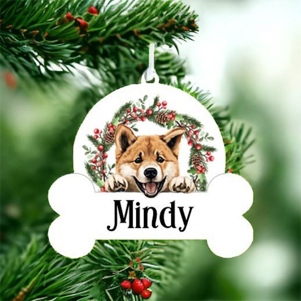 Personalised Christmas Bauble with Akita sat in a wreath