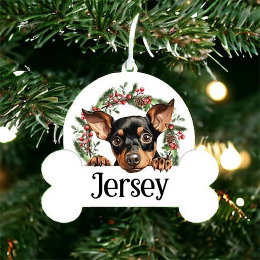 Personalised Christmas Bauble with Manchester Terrier sat in a wreath