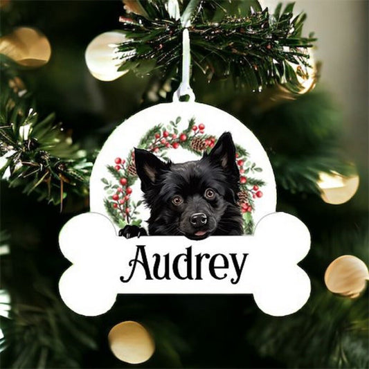 Personalised Christmas Bauble with Schipperke sat in a wreath