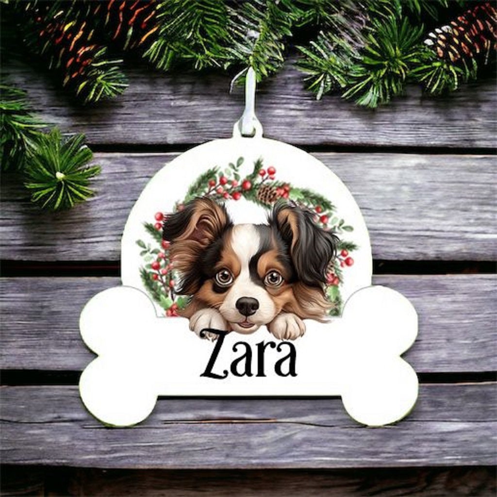 Personalised Christmas Bauble with Papillon sat in a wreath